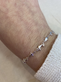 Pulsera delfines y estrellas acero blanco - comprar online