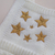 Romper em tricot branco bordado Estrelas unissex - comprar online