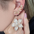 Brinco Ear Cuff Flor Luxo Zircônias Baguetes Banho Ouro na internet