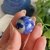 Behold the mesmerizing beauty of this Sodalite crystal sphere, renowned for its calming and balancing effects. Embrace its tranquil energy to foster clarity of thought and emotional harmony.