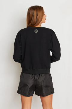 BUZO POLLUX NEGRO/LILA - comprar online