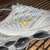 Mizuno Prophecy 8 - Branco/Dourado - comprar online