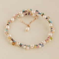 Colorful bracelet, embroidered with a mix of crystals, pearls and plated in 18k gold.