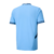 Camisa do Manchester City I 24/25, modelo torcedor da Puma, na cor azul, com detalhes em preto e logotipo do clube.