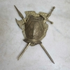 Antigo Escudo com brasão com espada e machado.