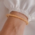 Pulseira Bracelete Aro com Vidrilhos Laranja no Dourado