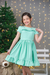 Vestido infantil festa verde com manga franzida e detalhe de babado no busto e saia três Marias - comprar online