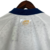 Camisa Bahia I 22/23 - Torcedor Esquadrão Feminina - Branca com detalhes em azul e dourado - comprar online