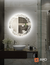 Espejo LED ARD Glanz Luminous Glass de 60 cm en un baño moderno, con diseño circular y luz alrededor.