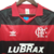 Camisa retrô do Flamengo de 1990, nas cores vermelha e preta, com logo da Adidas e patrocinador Lubrax.