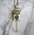 Amuleto pirita, malaquita y cuarzo cristal en internet