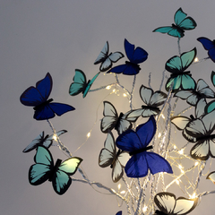 Mariposas en flor Forever Blue con florero de vidrio en internet