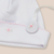 Set 4 piezas blanco y rosa con body cruzado, portachupete en caja - Infinita Ternura
