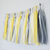 Pompones de flecos en papel seda amarillo pastel. 35 cms de largo. Paquete x 5 unidades - comprar online