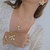 Bracelete Flor Espelhada e Pérola Banho Ouro 18K na internet