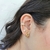 Ear Cuff Ponto de Luz, Corrente e Piercing Banho Ouro 18k na internet