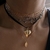 BLACK HALLOW GOLDEN LOCKET CHOKER en internet