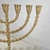 Menorah Candelabro Redondo Artesanal em Alumínio banho esmaltado dourado na internet