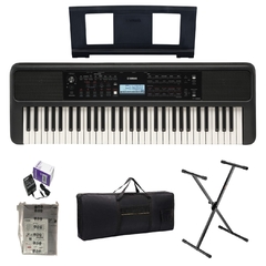 Teclado Yamaha PSR-E383 con base y estuche, incluyendo adaptador y manual de instrucciones.