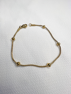 Pulsera bolitas acero dorado