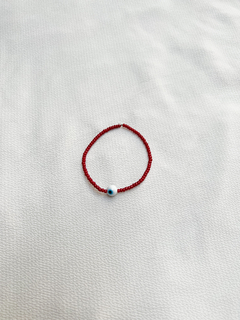 Pulsera elástica ojo turco y canutillos - bordó