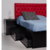 Cama elegante de color negro con 4 cajones y bauleras bajo el cochón, con respaldo capitoné color rojo | Belgrano Home