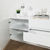 Estantes organizadores en mueble laqueado blanco minimalista para living | Belgrano Home