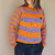 Imagen de Sweater Natalie lila y naranja