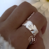 AN 195 - Anillo pluma abierto atras (ACERO BLANCO)