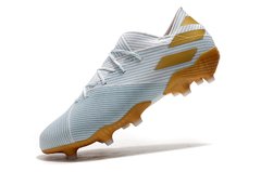 Chuteira Adidas Nemeziz 19.1 FG Dourado/Branco na internet