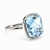Anillo Oro Blanco 18 Kts Topacio Azul Natural y diamantes ANDT013