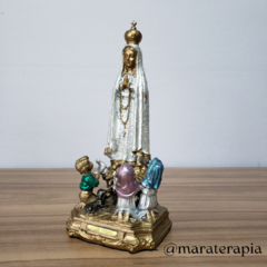 Nossa Senhora de Fátima com os 3 pastorinhos 23cm, em resina e adornos na internet