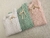 Variantes del sweater estrella, de hilo con bordado artesanal: blanco, rosa y acqua