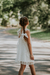 Nena con vestido Orquidea off white, de tul con volado en los breteles