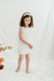 Nena con vestido Mantis off white, de gasa de algodon con recorte de tul en pechera y volado de tul en manga