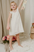 Nena con vestido Sepia off white,  estilo halter de fibrana bordada