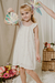 Nena con vestido Sepia off white,  estilo halter de fibrana bordada