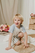 Nene con short Morus, con rayas azules, combinado con remera Gaviota