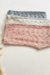 Variantes de la Calza Firenze Bebé, de morley, estampada: gris con negro, beige con lila y rosa con gris