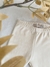 Detalle de la cintura de la calza taman beige, de plush