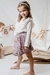 Nena con falda Monte fondo lila combinado con remera Sagano off white