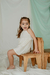 Nena con vestido Begonia, estilo halter de algodon con pechera bordada