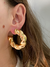 Argola tubular trançada - banhada à Ouro 18k - comprar online