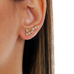 18k Gold Taurus earrings with white Sapphires or Diamonds on internet