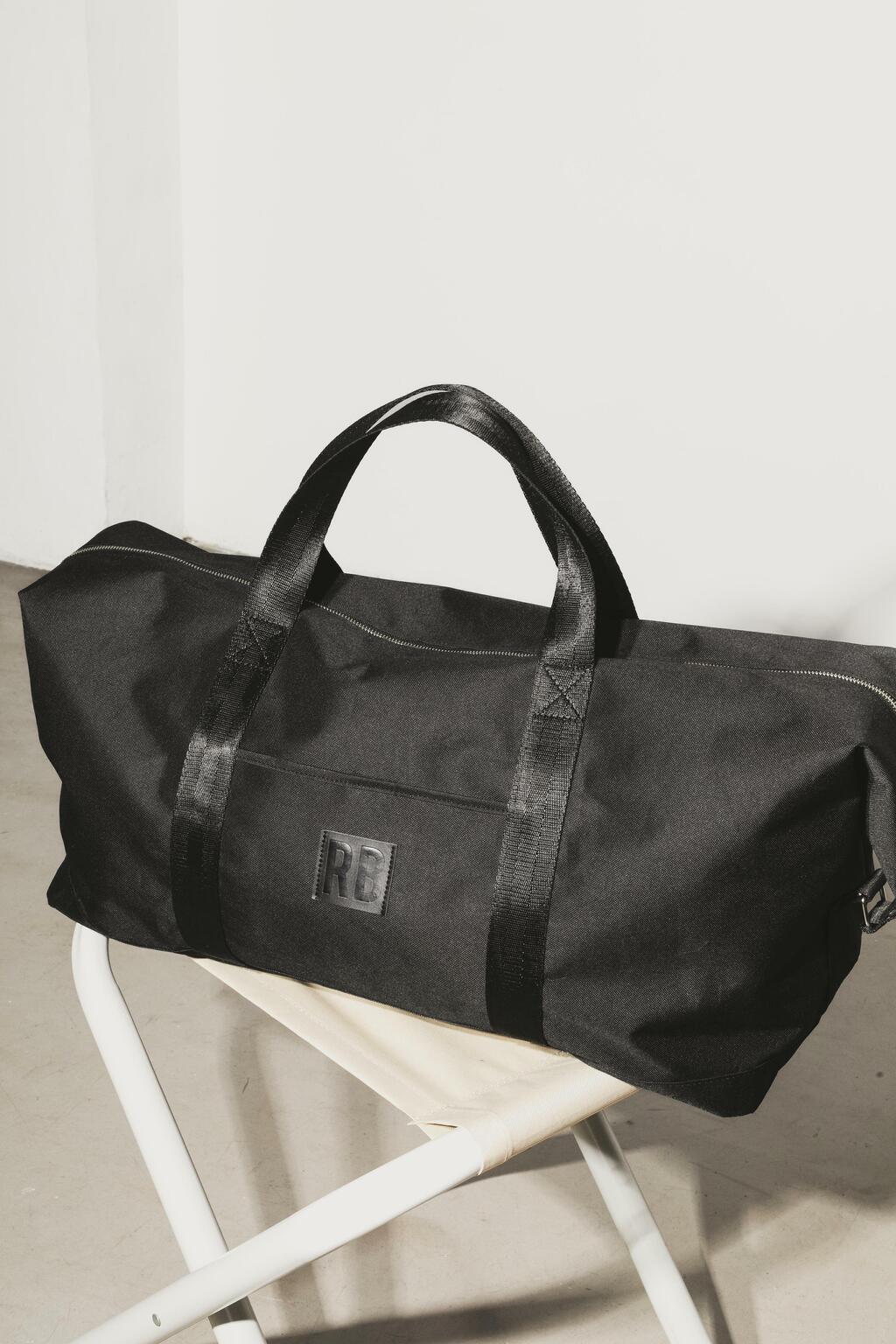 Bolso negro de viaje deals
