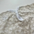 Macacão bebê de algodão bege - comprar online