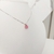 conjunto de colar e brinco mini gota rosa pastel com 3 pontos de luz pequenos banhado a prata - loja online