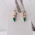 Brinco Ear cuff festa com pedras verdes e prata- Base dourada( Linha Premium)