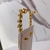 Imagem do Brinco ear cuff de franjas dourado e pedras prata na base dourada