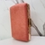 Bolsa clutch com camurça rosa com detalhes em dourado - comprar online